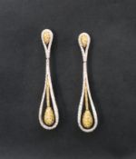A pair of 18ct gold diamond drop earrings, set with white and yellow round brilliant cut diamonds,