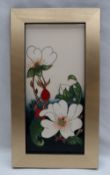 A Moorcroft pottery plaque, decorated with flowers and buds to a cream ground,