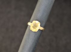 A 9ct gold dress ring, set with an oval faceted citrine, 12mm x 10mm, to a claw setting,