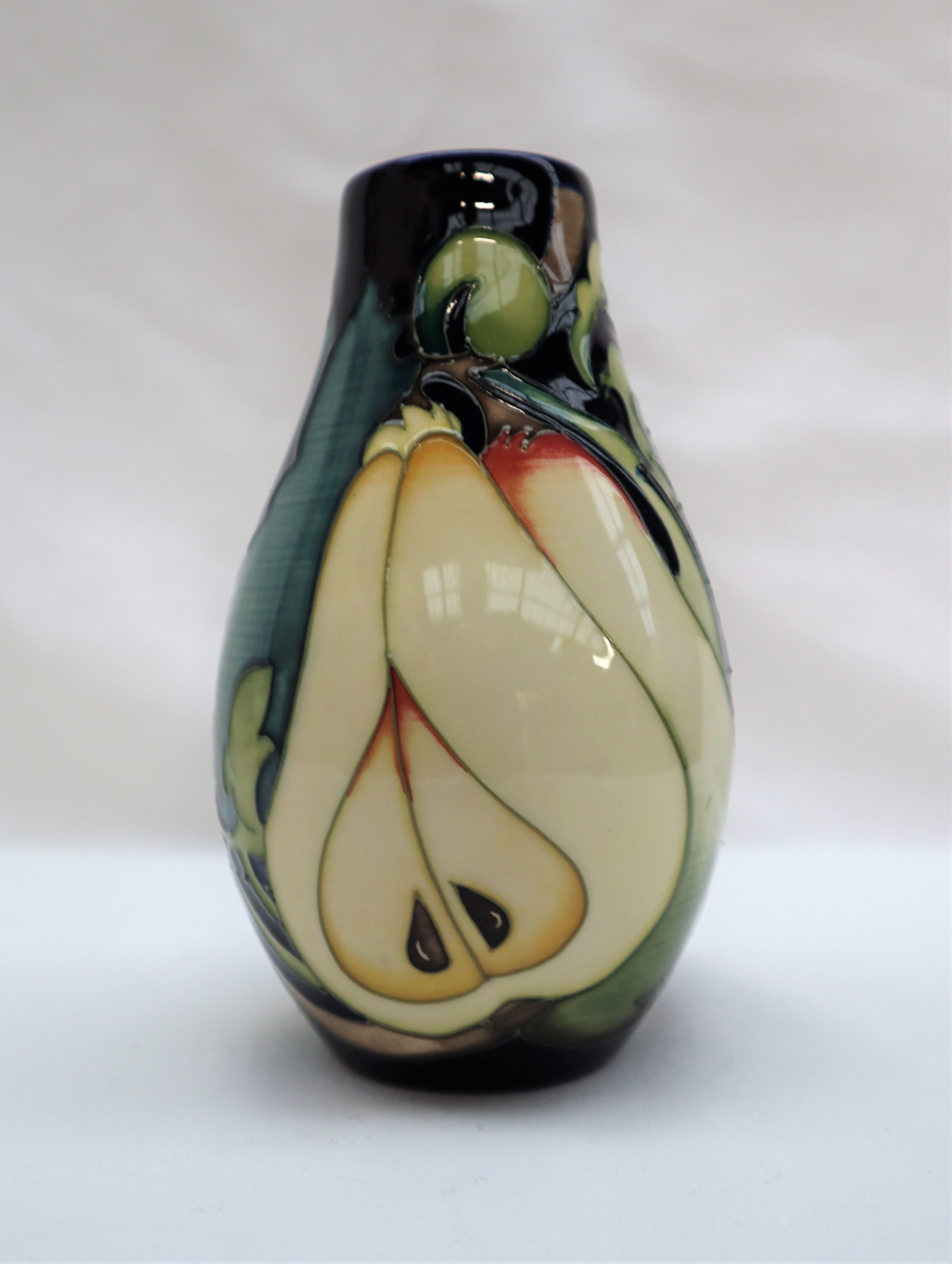 A limited edition Moorcroft pottery vase decorated with pears and flowers, dated 2010, - Image 2 of 5