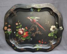 A Pontypool japanned tray of shaped rectangular form painted with a parrot amongst sprays of garden