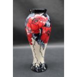 A Moorcroft pottery a More sacred place vase decorated with poppies, impressed mark,