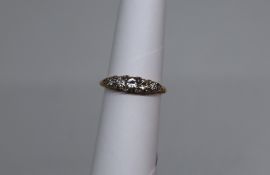 A diamond line ring, set with graduating old round cut diamonds to an 18ct gold setting and shank,