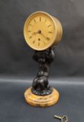 An early 19th century English gilt drum clock,