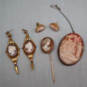 Two pairs of shell cameo and yellow metal earrings together with a cameo brooch and a cameo stick