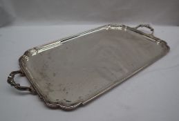 A George VI silver twin handled tray, of rectangular form with shaped corners, 50cm wide,