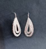 A pair of diamond drop earrings of tear drop shape,