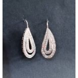 A pair of diamond drop earrings of tear drop shape,