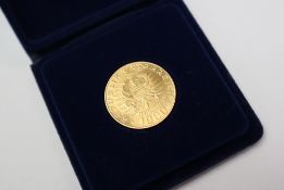 A 1976 gold Austrian 1000 schillings coin, "Einsetzung Der Babenberger 976-1976",