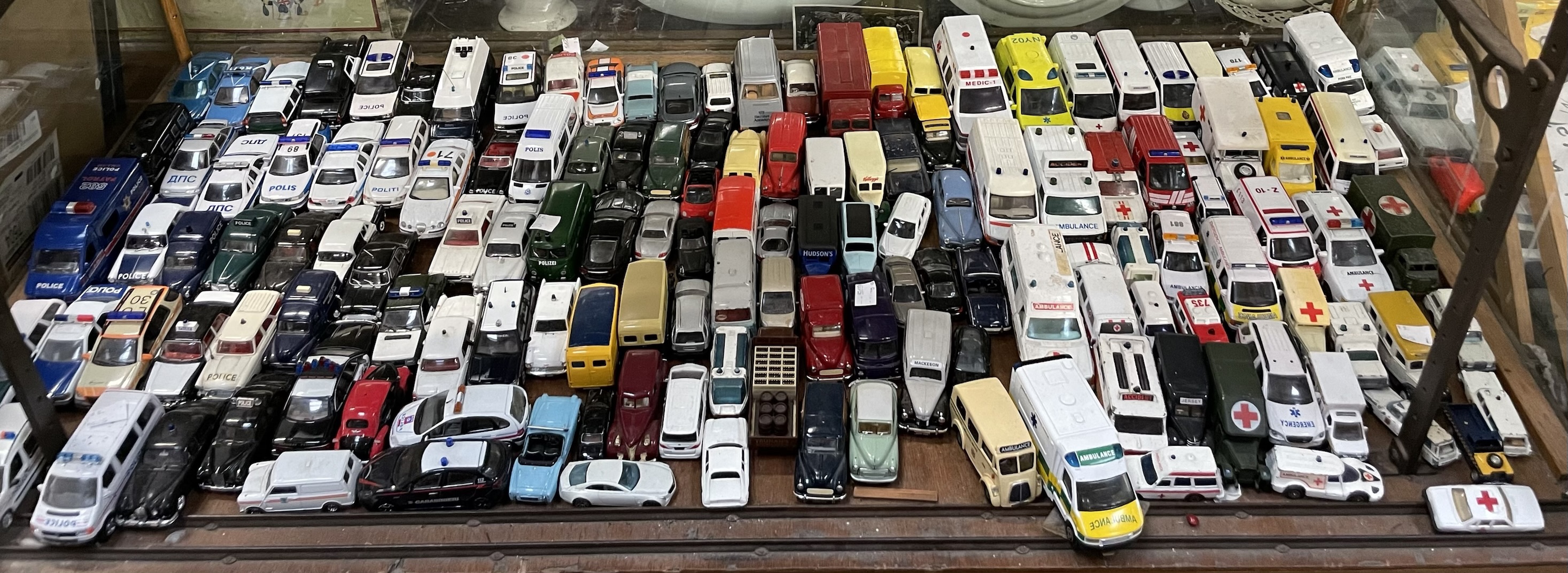 A large collection of unboxed model cars, mainly emergency vehicles including Corgi, Welly,
