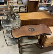 A chrome and glass tea trolley together with a brass fireside tidy and an occasional table