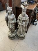 A pair of reconstituted stone figures of Arthur and Guinevere