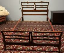 A 20th century mahogany ladder back head and foot board