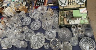 A large lot including glass decanters, glass bowls, glass vases,