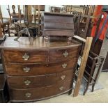 A George III mahogany chest of drawers together with a night table, a wine table, umbrella stand,