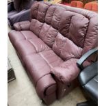 A maroon leather three seater reclining settee