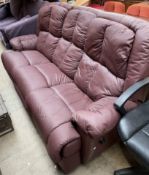 A maroon leather three seater reclining settee