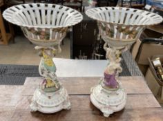 A pair of 19th century porcelain table centrepieces, with a flared pierced basket,