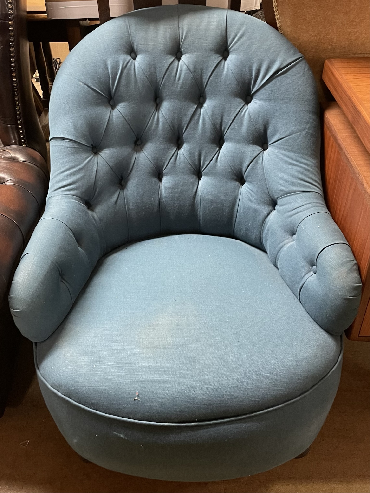 An Edwardian upholstered button back nursing chair