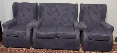 An upholstered two piece suite comprising a wing back two seater settee and two wing back arm