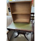 A reproduction mahogany sofa table together with a bookcase