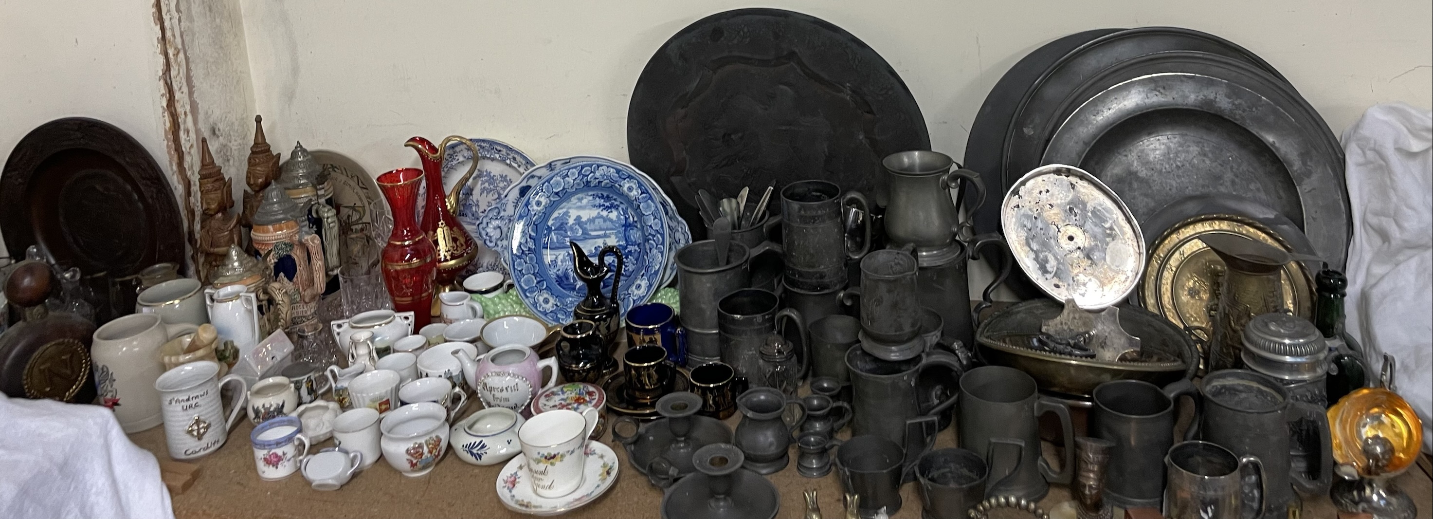 A collection of Pewter chargers, pewter tankards, electroplated wares, commemorative wares,