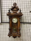 A walnut cased Vienna regulator type wall clock