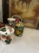 A Plichta preserve pot decorated with strawberries together with another preserve pot painted with