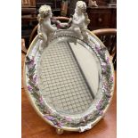 A Sitzendorf porcelain easel mirror decorated with cherubs and insects