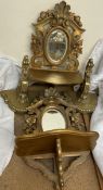 A pair of carved gilt decorated wall mirrors together with a pair of gilt wall brackets