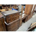 A 20th century oak dressing table together with a matching tallboy