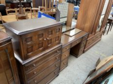 A 20th century oak dressing table together with a matching tallboy