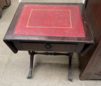 A small reproduction side table with red leather inset top
