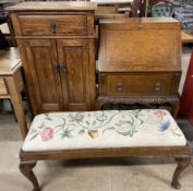 A reproduction burr walnut bureau together with an oak cabinet and a duet stool