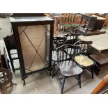A set of four spindle back dining chairs together with a display cabinet