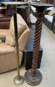 A mahogany torchere with a dished top above a barley twist column on a circular foot together with