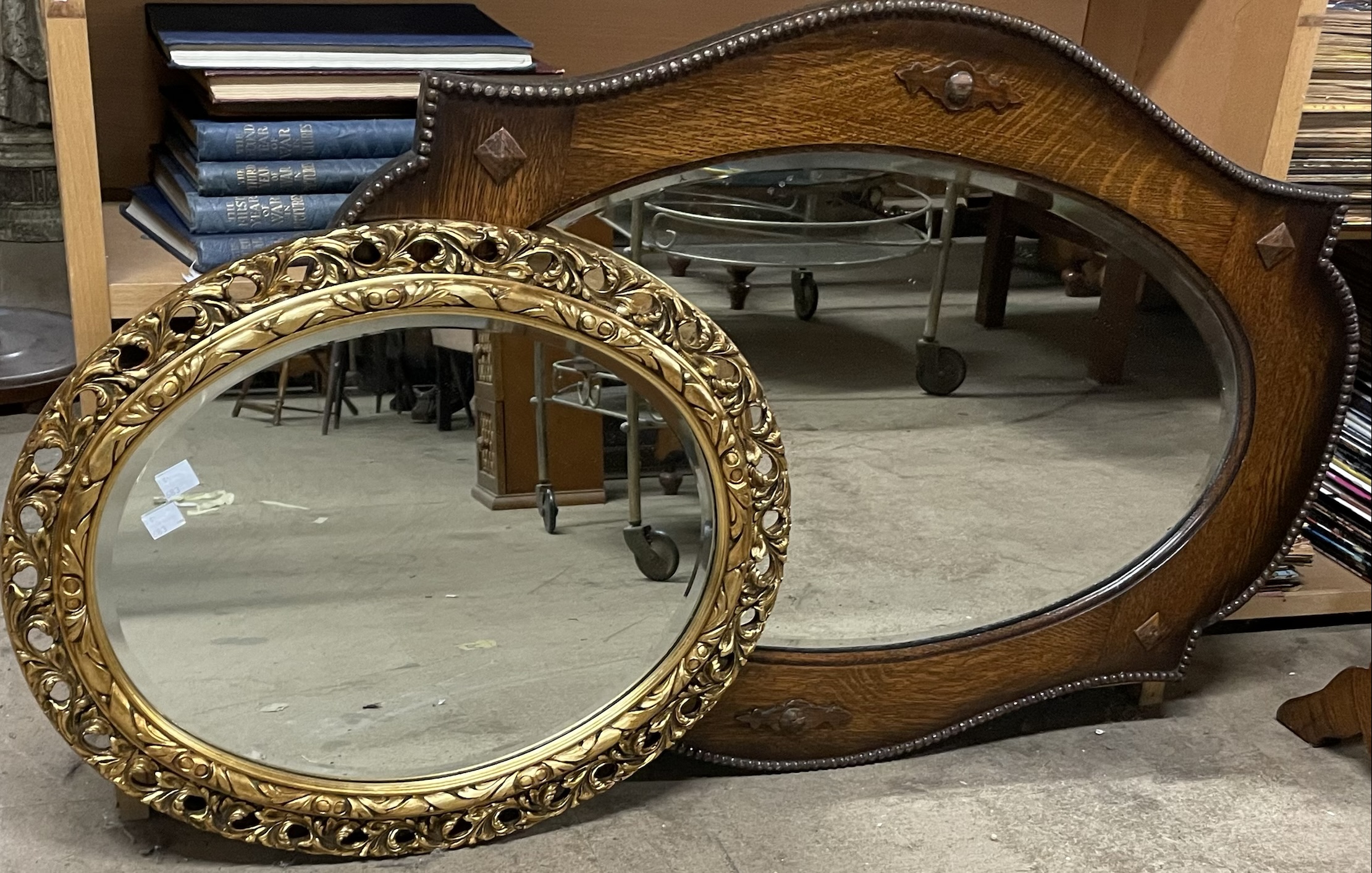 An oak framed wall mirror together with a gilt wall mirror