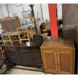 A dark oak sideboard together with an oak shoe cabinet,