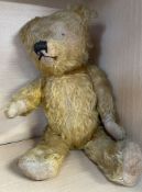 A mohair teddy bear with jointed limbs