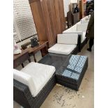 A nine piece garden furniture set, comprising arm chairs, settees,