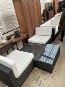 A nine piece garden furniture set, comprising arm chairs, settees,