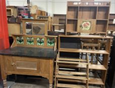 An Art Nouveau inspired pine washstand with a tiled back together with a pine hanging shelves,