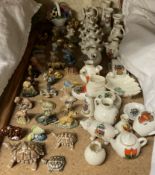 A collection of Wade animals together with assorted crested wares