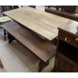An oak kitchen dining table and benches