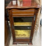 An Edwardian mahogany music cabinet,