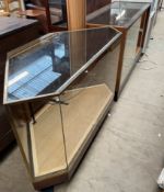 A brass and glass corner display cabinet together with a mahogany framed display cabinet