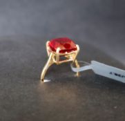 A Malagasy ruby 9k gold ring, set with a cushion cut 8.