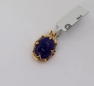 Gemporia - A tanzanite and blue diamond 9k gold pendant