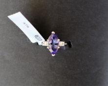 Gemporia - A tanzanite and white zircon 9k white gold ring, set with a 1.