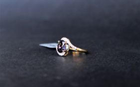 Gemporia - A Bengal iolite and white zircon 9k gold ring,